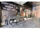This home gym features racks for weights and dumbbells, a mirror, and rubber flooring at 6731 Sumatra St, Las Vegas, NV 89166