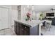 Charming kitchen featuring granite counters, stainless steel appliances, tile floor, and center island at 6731 Sumatra St, Las Vegas, NV 89166