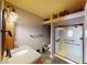 Bathroom featuring a walk-in shower with glass enclosure, vanity, and tile floors at 6901 Cobre Azul Ave # 202, Las Vegas, NV 89108