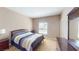 Bedroom with a bed, nightstand, and natural light at 6901 Cobre Azul Ave # 202, Las Vegas, NV 89108