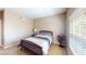 Neutral bedroom with a wooden bed frame and carpeted floors at 6901 Cobre Azul Ave # 202, Las Vegas, NV 89108