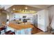 Bright kitchen features butcher block island, white cabinetry, and stainless steel appliances at 6901 Cobre Azul Ave # 202, Las Vegas, NV 89108