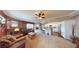 Spacious living room showcasing a brick fireplace and seamless flow into the updated kitchen at 6901 Cobre Azul Ave # 202, Las Vegas, NV 89108