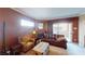 Inviting living room with cozy seating, brick fireplace, and sliding doors to the outdoors at 6901 Cobre Azul Ave # 202, Las Vegas, NV 89108