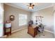 Home office with natural light and a classic wood desk at 6901 Cobre Azul Ave # 202, Las Vegas, NV 89108