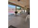 Large covered patio space with ceiling fan and seating, perfect for relaxing and enjoying the weather at 7650 Butterscotch Ct, Las Vegas, NV 89131