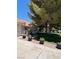 Beautiful home exterior with lush landscaping and charming details at 7650 Butterscotch Ct, Las Vegas, NV 89131
