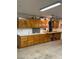 Garage features ample storage with cabinets, a countertop, and a storage vacuum at 7650 Butterscotch Ct, Las Vegas, NV 89131