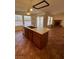 Kitchen featuring a center island, tile floors, and modern appliances at 7650 Butterscotch Ct, Las Vegas, NV 89131