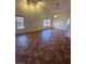 Bright living room with tile floors, two windows, and a ceiling fan at 7650 Butterscotch Ct, Las Vegas, NV 89131