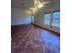 Bright living room with tile floors, and a ceiling fan at 7650 Butterscotch Ct, Las Vegas, NV 89131