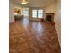 Open living area with tiled flooring and corner fireplace at 7650 Butterscotch Ct, Las Vegas, NV 89131