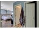 View down the hallway with bedrooms and bathrooms with light blue-painted walls at 7651 E Anatolian St, Las Vegas, NV 89166