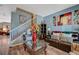 Inviting living room featuring wood floors, a staircase, and stylish décor at 7651 E Anatolian St, Las Vegas, NV 89166