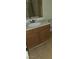 Bathroom vanity featuring wood cabinets and a white countertop and sink at 833 Aspen Peak Loop # 1524, Henderson, NV 89011