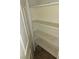 Linen closet featuring three shelves adorned with decorative floral paper at 833 Aspen Peak Loop # 1524, Henderson, NV 89011