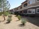 A multi-story apartment building has well-kept landscaping and an inviting facade at 833 Aspen Peak Loop # 1524, Henderson, NV 89011