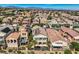Stunning aerial view of homes with pools, balconies, tile roofs and desert landscaping, complete with solar panels in a Gathering-friendly area at 841 Colina Alta Pl, Las Vegas, NV 89138