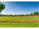 Community baseball field featuring a well-maintained green outfield, backstop, and manicured infield at 841 Colina Alta Pl, Las Vegas, NV 89138