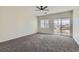 Carpeted bedroom offering natural light, balcony access and views of the outside neighborhood at 841 Colina Alta Pl, Las Vegas, NV 89138