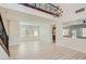 Open-concept living room with wood floors, lots of windows, and staircase at 841 Colina Alta Pl, Las Vegas, NV 89138