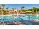 A community pool featuring lap lanes and a spacious deck area for residents to enjoy under the shade of palm trees at 841 Colina Alta Pl, Las Vegas, NV 89138