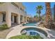 Inviting pool with a waterfall feature, a jacuzzi, and a desert-style garden at 841 Colina Alta Pl, Las Vegas, NV 89138