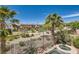 Backyard view with desert landscaping and a fenced pool, offering great privacy at 841 Colina Alta Pl, Las Vegas, NV 89138