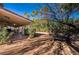 A large backyard shows a covered patio and lounge seating, perfect for outdoor enjoyment at 884 E Robindale Rd, Las Vegas, NV 89123