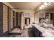This bathroom has double sinks, a large mirror and a walk in shower at 884 E Robindale Rd, Las Vegas, NV 89123