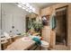 This bathroom has a large mirror, single sink and walk in shower at 884 E Robindale Rd, Las Vegas, NV 89123