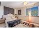 Cozy bedroom featuring a decorative wall and carpet accent at 884 E Robindale Rd, Las Vegas, NV 89123