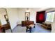 View of bedroom decor with wooden chest, mirror, and a wooden dresser at 884 E Robindale Rd, Las Vegas, NV 89123
