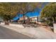 Charming two-story home with mature trees surrounding, and a well maintained front yard at 884 E Robindale Rd, Las Vegas, NV 89123