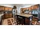 Beautiful kitchen with granite countertops, stainless steel appliances and an island with seating at 884 E Robindale Rd, Las Vegas, NV 89123