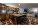 Beautiful kitchen with granite countertops, stainless steel appliances and an island with seating at 884 E Robindale Rd, Las Vegas, NV 89123