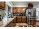 Updated kitchen with granite countertops, stainless steel appliances, and ample cabinet space at 884 E Robindale Rd, Las Vegas, NV 89123