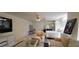 Bright living room featuring comfortable armchairs and a four-poster bed at 884 E Robindale Rd, Las Vegas, NV 89123