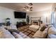 Relaxing living room featuring a fireplace, TV, and sectional sofa for Gathering living at 884 E Robindale Rd, Las Vegas, NV 89123