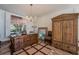 Home office with large window and classic, ornate furniture for work or study at 884 E Robindale Rd, Las Vegas, NV 89123