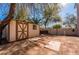 A backyard shows a shed for storage, and a fenced area with room for potential landscaping at 884 E Robindale Rd, Las Vegas, NV 89123