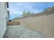 Expansive backyard featuring a gray brick patio and tall brick walls, offering privacy and space at 8909 Cherry Barn St, Las Vegas, NV 89113