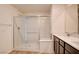 Elegant bathroom featuring glass enclosed shower, dual sink vanity, and modern fixtures at 8909 Cherry Barn St, Las Vegas, NV 89113