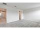 Bright bedroom with neutral walls and carpets and view to the home's hallway at 8909 Cherry Barn St, Las Vegas, NV 89113