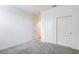 Carpeted bedroom features a closet and entry to other rooms at 8909 Cherry Barn St, Las Vegas, NV 89113
