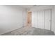 Bedroom features neutral walls and carpet, closet, and views to other rooms in the home at 8909 Cherry Barn St, Las Vegas, NV 89113