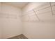 Walk-in closet featuring wire shelving and neutral walls and carpets at 8909 Cherry Barn St, Las Vegas, NV 89113