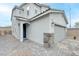 Well-maintained two-story home with a gray exterior and a paved driveway at 8909 Cherry Barn St, Las Vegas, NV 89113