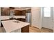 Modern kitchen with white countertops, stainless appliances, and abundant cabinetry at 8909 Cherry Barn St, Las Vegas, NV 89113