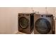 Modern laundry room with front loading washer and dryer set, perfect for easy laundry days at 8909 Cherry Barn St, Las Vegas, NV 89113